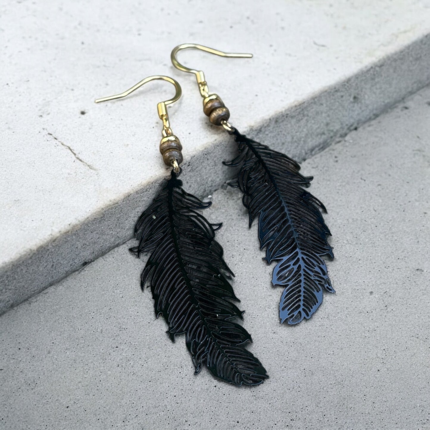 Boucles plumes noires