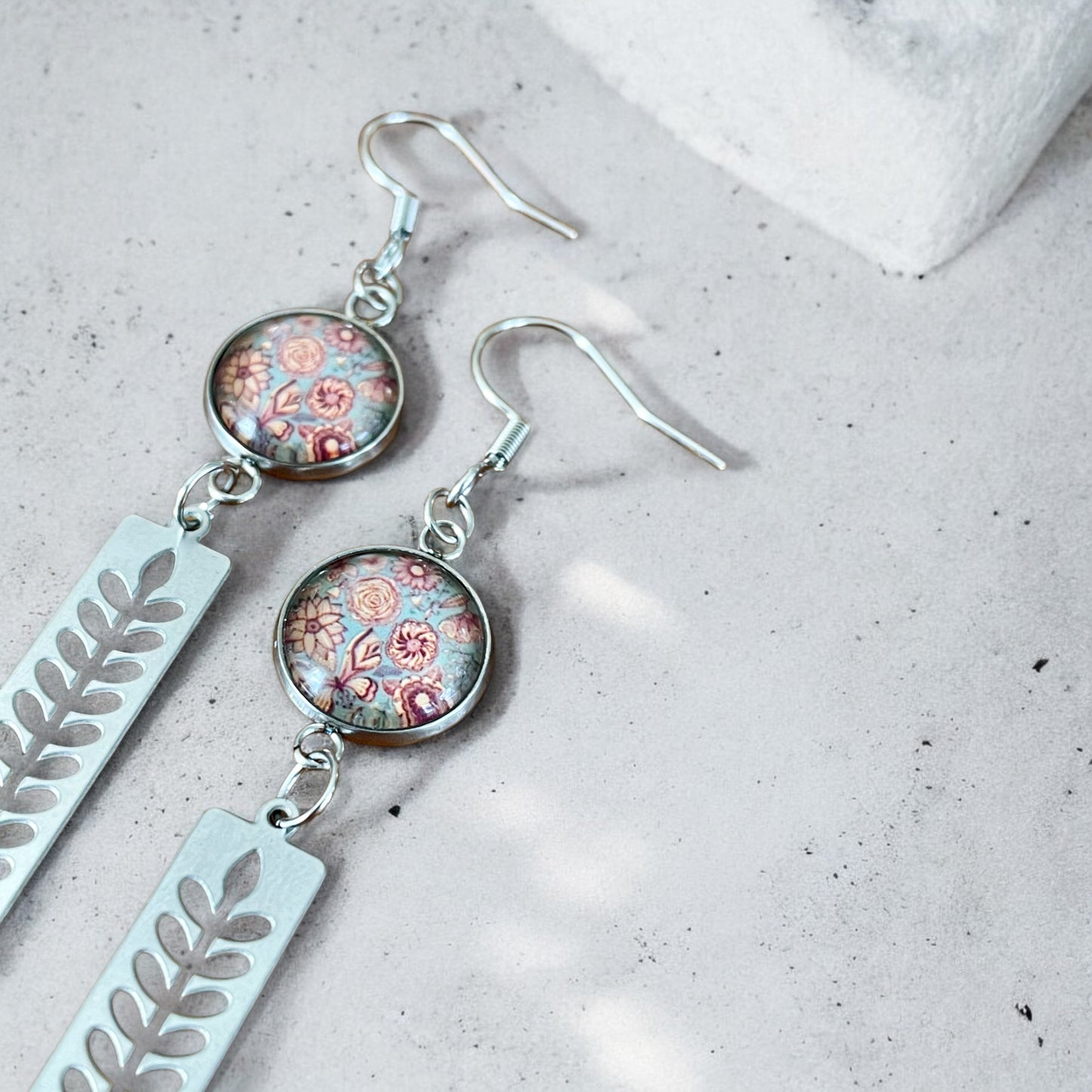 Longues boucles feuillage inox